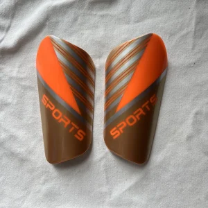 Factory Custom Logo Sublimation Shin Guards Soccer PP EVA Football Shin Pads Adult Sports Protection Orange