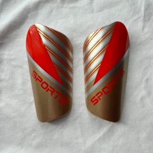 Factory Custom Logo Sublimation Shin Guards Soccer PP EVA Football Shin Pads Adult Sports Protection Orange red